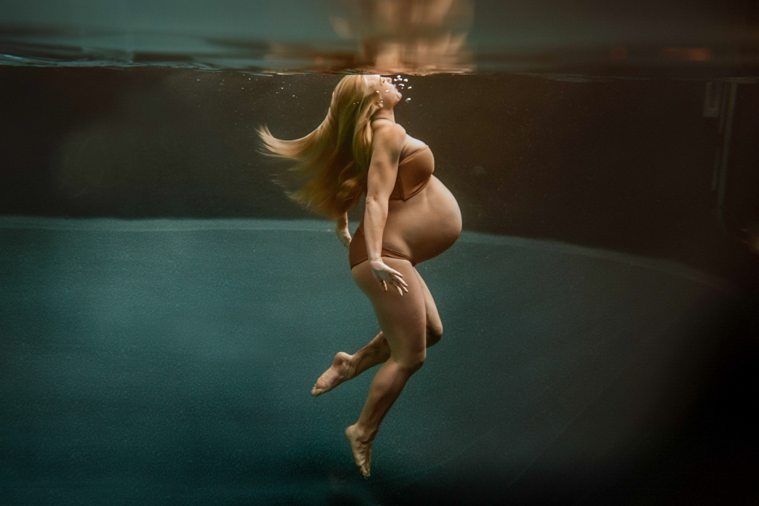 Pregnancy-Is-Magic-Mother-In-Pool